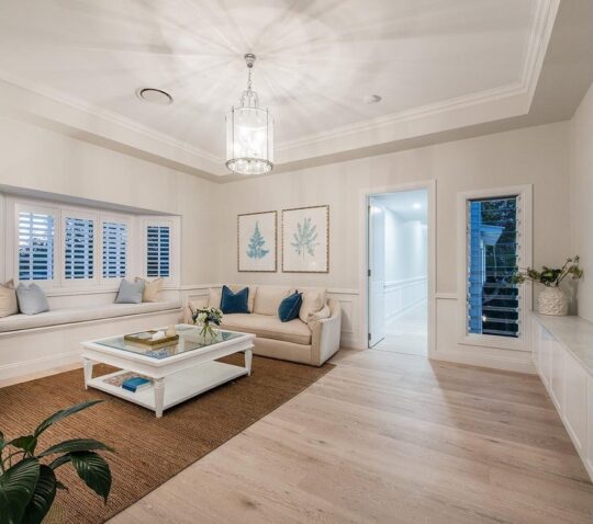 Prestige Oak White Sands engineered timber installed room example